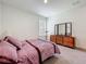 Cozy bedroom featuring plush bedding and a classic dresser with mirrored accents at 14001 Jomatt Loop, Winter Garden, FL 34787