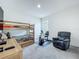 Functional bedroom with bunk beds, a recumbent bike and sitting chair at 14001 Jomatt Loop, Winter Garden, FL 34787