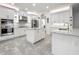 Spacious kitchen featuring stainless steel appliances, white cabinets, and a large island at 14001 Jomatt Loop, Winter Garden, FL 34787