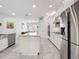 Open concept kitchen featuring stainless appliances and views of the dining room at 14001 Jomatt Loop, Winter Garden, FL 34787