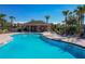 Community pool and pool house with ample seating and a clear view of the beautiful blue pool at 14001 Jomatt Loop, Winter Garden, FL 34787