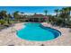 Community pool and pool house with ample seating and a clear view of the beautiful blue pool at 14001 Jomatt Loop, Winter Garden, FL 34787
