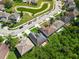 Bird's eye view showcasing a well-maintained roof, a charming back deck, and adjacent lush foliage at 145 Circle Hill Rd, Sanford, FL 32773