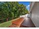 A spacious backyard deck with wood railings, offering a perfect spot for outdoor gatherings and enjoying the green surroundings at 145 Circle Hill Rd, Sanford, FL 32773