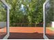 The backyard deck, accessible through glass doors, offers a peaceful outdoor space surrounded by lush greenery and a sense of privacy at 145 Circle Hill Rd, Sanford, FL 32773