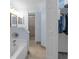 Bathroom with a soaking tub and a walk-in shower at 145 Circle Hill Rd, Sanford, FL 32773