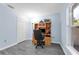 The bedroom features wood-look floors, a window with natural light and a built-in wooden desk with shelves, plus a closet at 145 Circle Hill Rd, Sanford, FL 32773