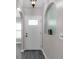 Bright entryway featuring decorative arches, a stylish front door and modern flooring at 145 Circle Hill Rd, Sanford, FL 32773
