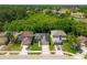 Aerial view of a well-manicured property featuring a lush green lawn and a car parked in the driveway at 145 Circle Hill Rd, Sanford, FL 32773