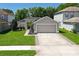 Charming single-story home with a well-manicured lawn, a two-car garage, and inviting curb appeal in a desirable neighborhood at 145 Circle Hill Rd, Sanford, FL 32773