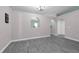 Bright living room with gray floors and decorative archways at 145 Circle Hill Rd, Sanford, FL 32773