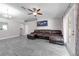 Open concept living room with gray floors and french doors to the backyard at 145 Circle Hill Rd, Sanford, FL 32773