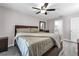 Bright main bedroom with gray floors and an attached bathroom at 145 Circle Hill Rd, Sanford, FL 32773