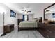 Bright main bedroom with gray floors, fan, and large window at 145 Circle Hill Rd, Sanford, FL 32773