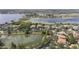 Aerial view showcasing the lakefront homes and community at 14700 Avenue Of The Rushes, Winter Garden, FL 34787