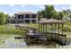 Spacious home featuring a backyard with screened in pool, and covered boat dock at 14700 Avenue Of The Rushes, Winter Garden, FL 34787