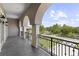 Large balcony with wrought iron railing offering beautiful neighborhood and lake views at 14700 Avenue Of The Rushes, Winter Garden, FL 34787