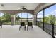 Relaxing balcony featuring wrought iron railing with beautiful views of a serene lake and trees at 14700 Avenue Of The Rushes, Winter Garden, FL 34787