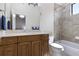Modern bathroom featuring a tub-shower combination, marble countertop, and wooden cabinets at 14700 Avenue Of The Rushes, Winter Garden, FL 34787