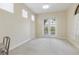 Bright, empty bedroom with a balcony entrance and three large windows, perfect for natural light at 14700 Avenue Of The Rushes, Winter Garden, FL 34787