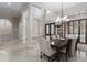 Bright dining area with marble floors, a chandelier, and plantation shutters at 14700 Avenue Of The Rushes, Winter Garden, FL 34787