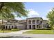 Charming two-story home with arched entryways, mature landscaping, and a three-car garage at 14700 Avenue Of The Rushes, Winter Garden, FL 34787