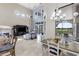 Open living area with water views, fireplace, and access to the kitchen at 14700 Avenue Of The Rushes, Winter Garden, FL 34787