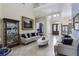 Elegant living room with soaring ceilings, decorative display cases, and marble flooring at 14700 Avenue Of The Rushes, Winter Garden, FL 34787