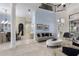 Open-concept living area with marble floors, a dining area, and a second-story landing at 14700 Avenue Of The Rushes, Winter Garden, FL 34787