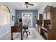 Spacious office featuring beautiful wooden furniture, neutral paint, and access to a balcony at 14700 Avenue Of The Rushes, Winter Garden, FL 34787