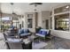 Inviting outdoor living space features stylish seating, a grill, and beautiful views of the property at 14700 Avenue Of The Rushes, Winter Garden, FL 34787