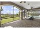 Spacious screened patio with lounge chairs and beautiful water views at 14700 Avenue Of The Rushes, Winter Garden, FL 34787