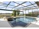 Sparkling pool and spa with screened enclosure overlooking the serene water at 14700 Avenue Of The Rushes, Winter Garden, FL 34787