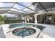 Screened pool area features pool, spa, and an outdoor dining area at 14700 Avenue Of The Rushes, Winter Garden, FL 34787
