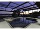Screened-in pool and spa offers a relaxing oasis with a stunning sunset view over the lake at 14700 Avenue Of The Rushes, Winter Garden, FL 34787