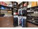 Walk-in closet with custom shelving and drawers, offering ample storage for clothes, shoes, and accessories at 14700 Avenue Of The Rushes, Winter Garden, FL 34787