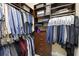 Walk-in closet with organized shelving and hanging rods, maximizing storage and accessibility for clothing and accessories at 14700 Avenue Of The Rushes, Winter Garden, FL 34787