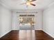 Bedroom features hardwood floors, ceiling fan, and access to outdoor pool area at 148 Oak View Cir, Lake Mary, FL 32746