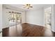 Bedroom offers beautiful hardwood flooring, ceiling fan, and access to the outdoor patio at 148 Oak View Cir, Lake Mary, FL 32746