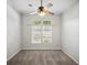Bedroom with plush carpet, ceiling fan, and windows with blinds at 148 Oak View Cir, Lake Mary, FL 32746