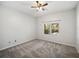 Neutral bedroom with carpet, ceiling fan, and windows showing outdoor views at 148 Oak View Cir, Lake Mary, FL 32746