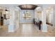 The dining room offers a decorative chandelier, custom wood ceiling and access to a kitchen area at 148 Oak View Cir, Lake Mary, FL 32746