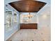 Dining room features custom wood ceiling, decorative chandelier, and custom bar with granite countertop at 148 Oak View Cir, Lake Mary, FL 32746