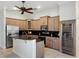 Spacious kitchen with granite counters, stainless appliances, wine fridge, and custom cabinetry at 148 Oak View Cir, Lake Mary, FL 32746