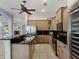 Modern kitchen with stainless steel appliances, granite countertops, and a wine fridge at 148 Oak View Cir, Lake Mary, FL 32746