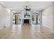 The living room features a ceiling fan, fireplace, and access to a covered patio at 148 Oak View Cir, Lake Mary, FL 32746