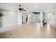 Open floor plan featuring decorative columns, tile flooring, ceiling fan and access to a bar at 148 Oak View Cir, Lake Mary, FL 32746