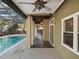 Inviting covered outdoor patio with pool views, perfect for relaxation and entertainment at 148 Oak View Cir, Lake Mary, FL 32746