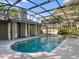 A beautiful backyard pool with a screened enclosure, perfect for relaxing and entertaining, plus a nearby hot tub at 148 Oak View Cir, Lake Mary, FL 32746