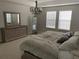 This bedroom offers great natural light, dresser, and decor at 14841 Porter Rd, Winter Garden, FL 34787